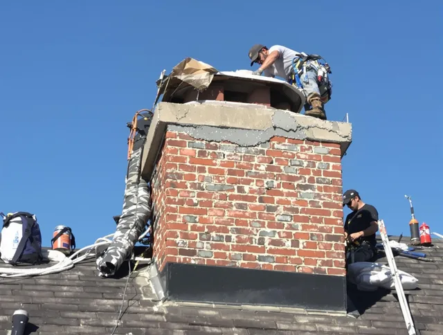 Monterey Park Chimney Sweep installing a custom chimney crown in Monterey Park, CA