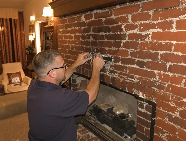 Monterey Park Chimney Sweep expert fixing a fireplace in Monterey Park, CA